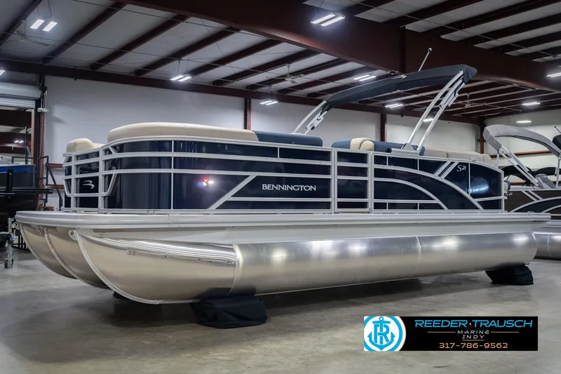 Slide: The Image of 2026 Bennington 21 SLJ pontoon boat in showroom, featuring sleek design and modern amenities. - 3