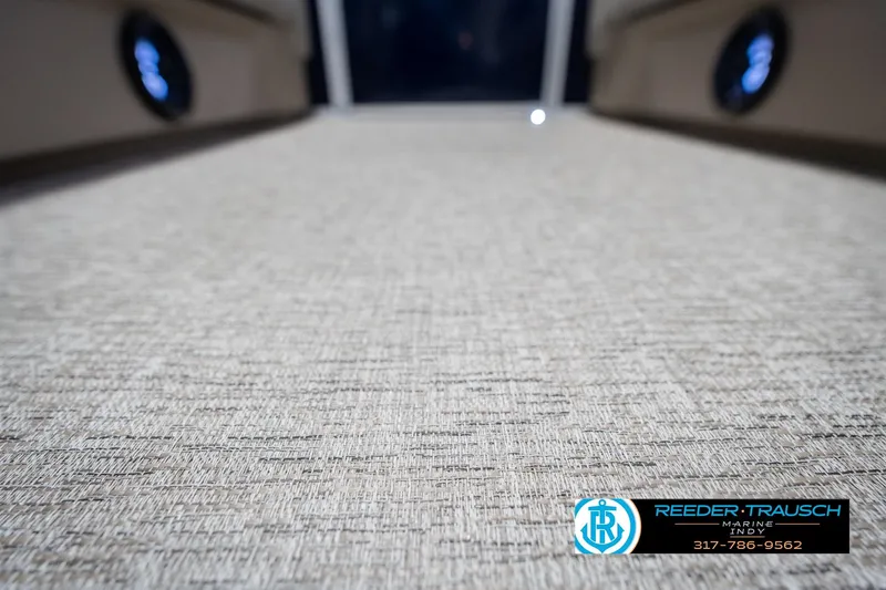 Slide: The Image of 2026 Bennington 21 SLJ boat interior flooring with Reeder Trausch Marine logo. - 43