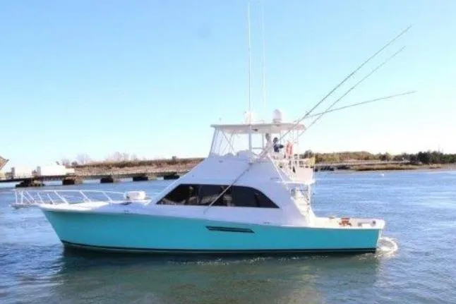 The Image of 2000 Ocean Yacht 48 Super Sport cruising on calm waters. - 0