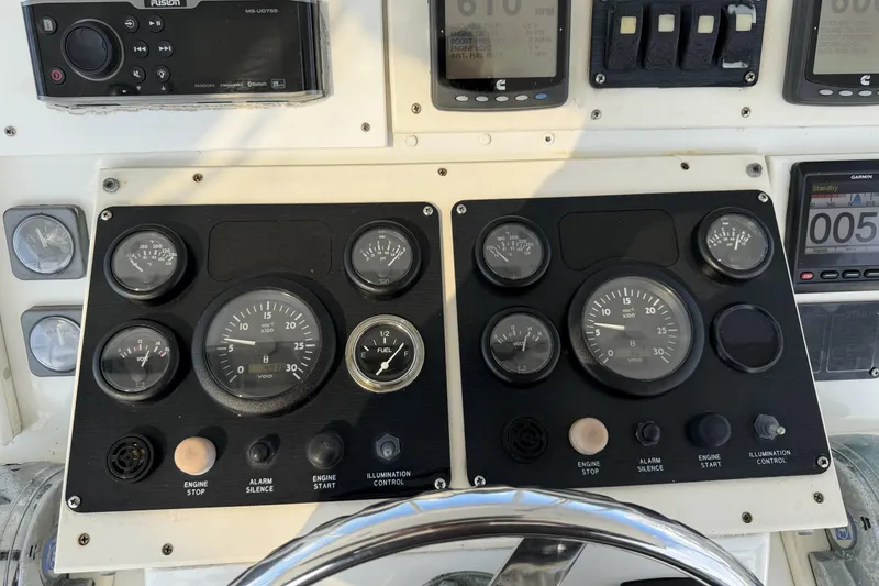 Slide: The Image of Control panel of a 1990 Ocean Yachts 48 Super Sport with gauges and switches. - 13