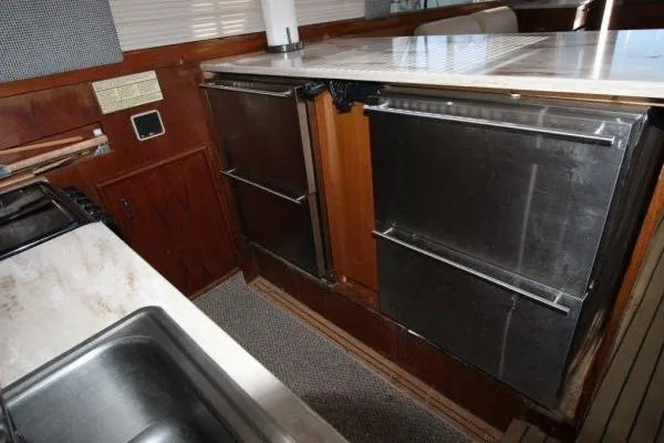 Slide: The Image of Galley kitchen in 2000 Ocean Yacht 48 Super Sport with stainless steel appliances. - 16