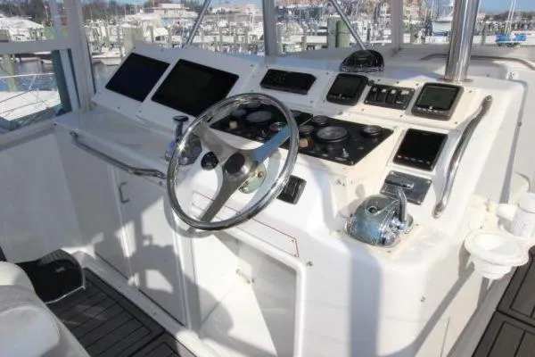 Slide: The Image of Cockpit of 2000 Ocean Yacht 48 Super Sport with steering wheel and control panels. - 3