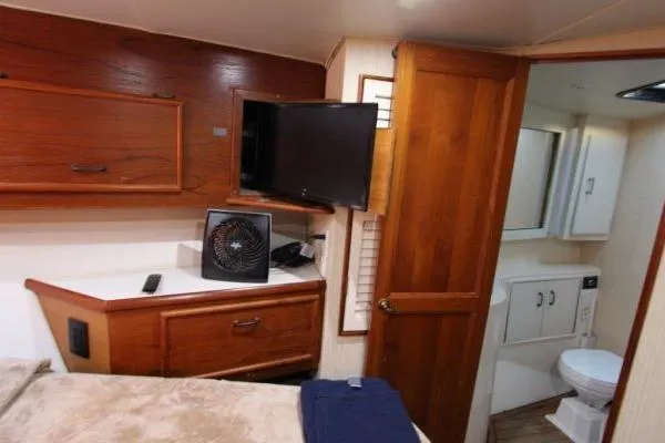 Slide: The Image of Interior of 2000 Ocean Yacht 48 Super Sport with wood cabinetry and bathroom. - 30