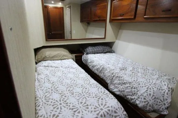Slide: The Image of Twin beds in a cozy cabin of a 2000 Ocean Yacht 48 Super Sport. - 31