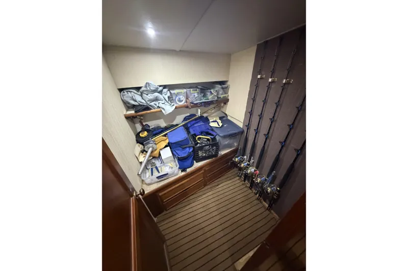 Slide: The Image of Storage area on 1990 Ocean Yachts 48 Super Sport with fishing gear and equipment. - 33