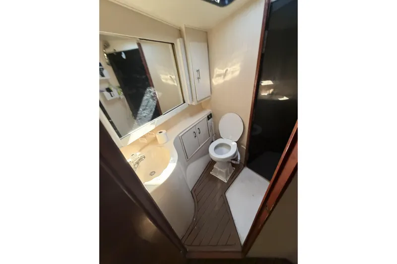 Slide: The Image of Bathroom interior of 1990 Ocean Yachts 48 Super Sport with sink and toilet. - 35