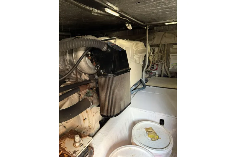 Slide: The Image of Engine room of a 1990 Ocean Yachts 48 Super Sport with visible components and wiring. - 36