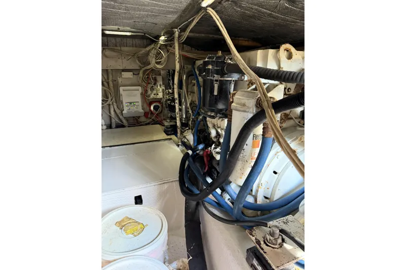 Slide: The Image of Engine room of 1990 Ocean Yachts 48 Super Sport with visible wiring and components. - 37