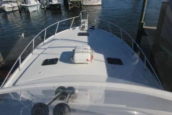 Slide: The Image of Bow view of 2000 Ocean Yacht 48 Super Sport docked at marina. - 4