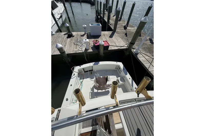Slide: The Image of 1990 Ocean Yachts 48 Super Sport docked at marina, viewed from above. - 6