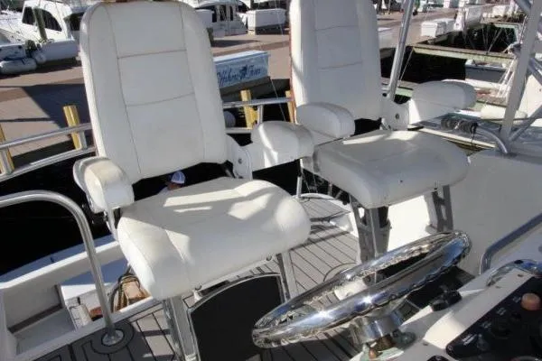 Slide: The Image of Captain's chairs on a 2000 Ocean Yacht 48 Super Sport, featuring a sleek helm design. - 9