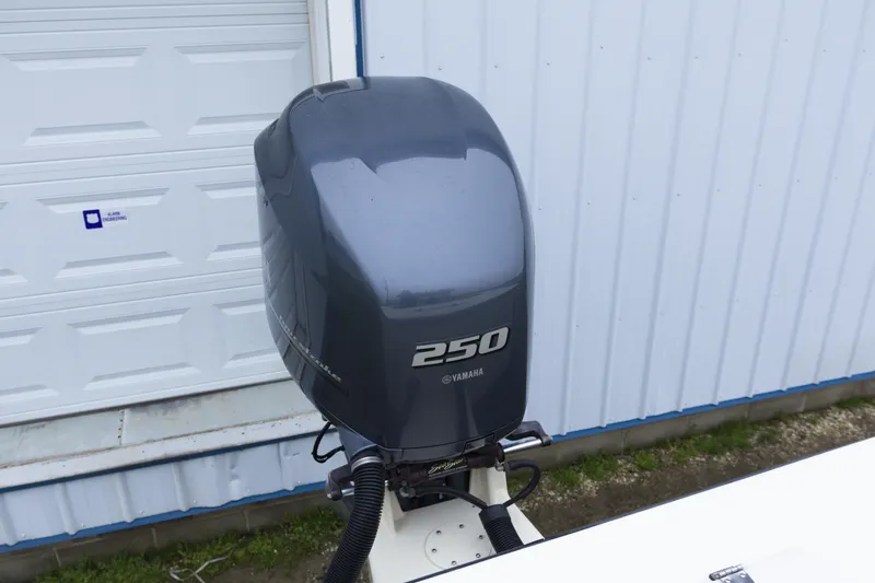 Slide: The Image of Yamaha 250 outboard motor on a 2000 May-Craft 2550 Cabin boat. - 9