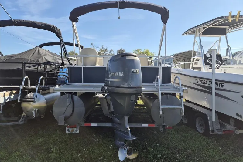 Slide: The Image of 2014 SunChaser 8522 C-N-F pontoon boat with Yamaha 90 engine, docked beside Hydra-Sports boat. - 10