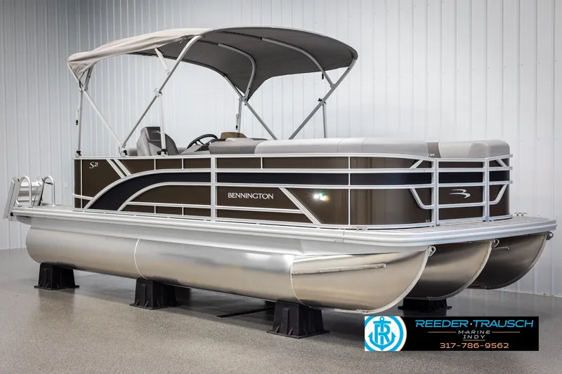 Slide: The Image of 2025 Bennington 21 SL pontoon boat in a showroom. - 3