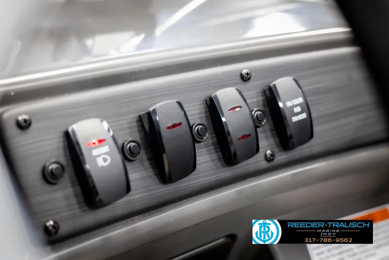 Slide: The Image of Dashboard of Bennington 21 SL 2025 with toggle switches. - 31