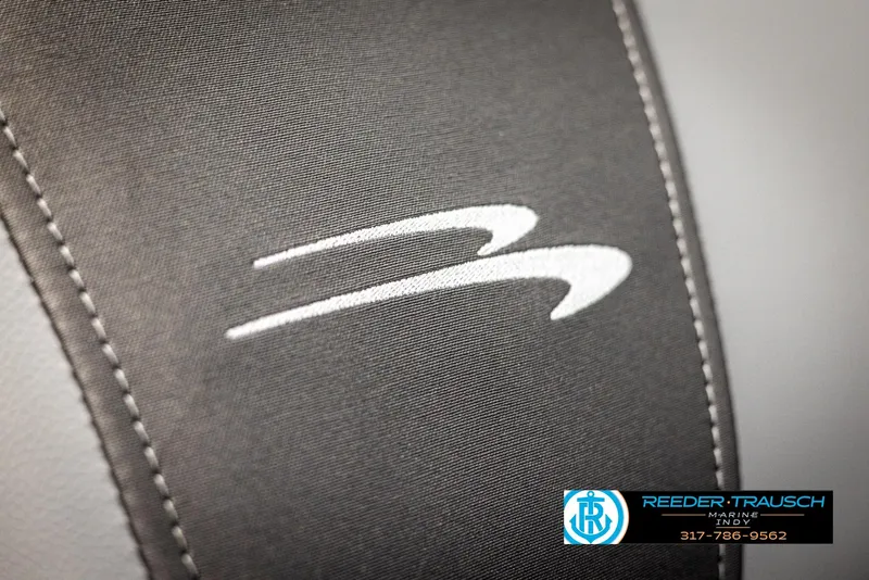 Slide: The Image of Close-up of Bennington 21 SL logo on gray fabric. - 37
