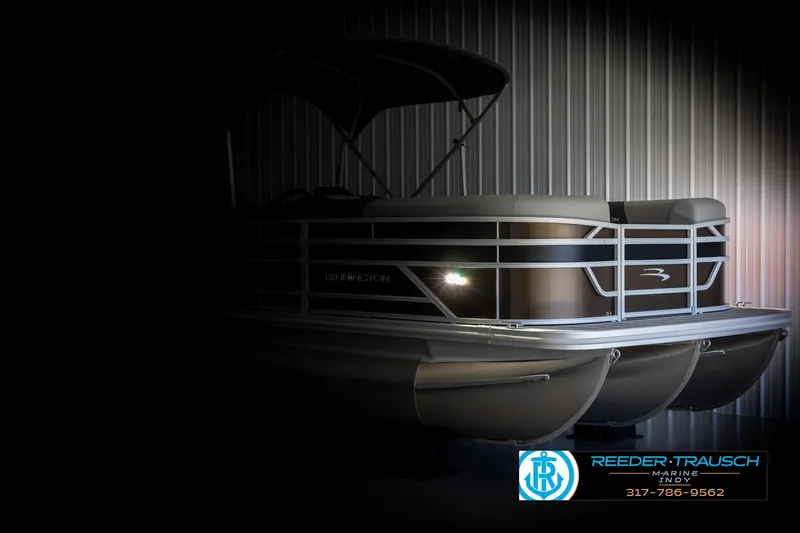 Slide: The Image of 2025 Bennington 21 SL pontoon boat in dark setting. - 4