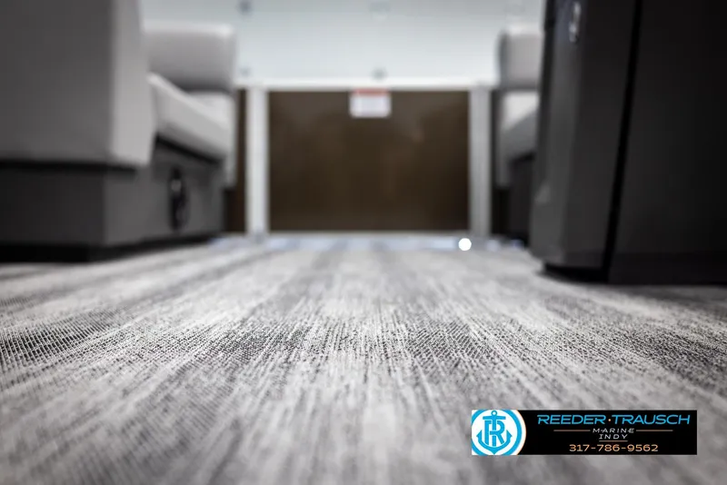 Slide: The Image of Interior of 2025 Bennington 21 SL with modern carpet flooring. - 42