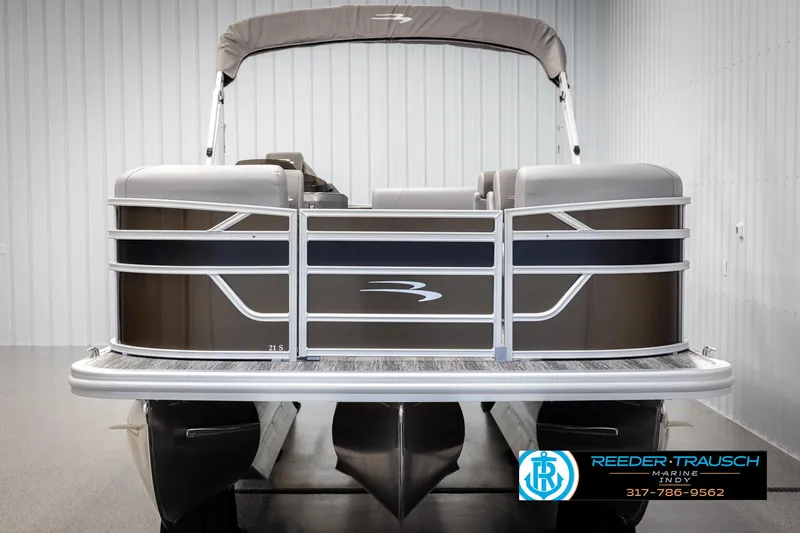 Slide: The Image of 2025 Bennington 21 SL pontoon boat in a showroom. - 8