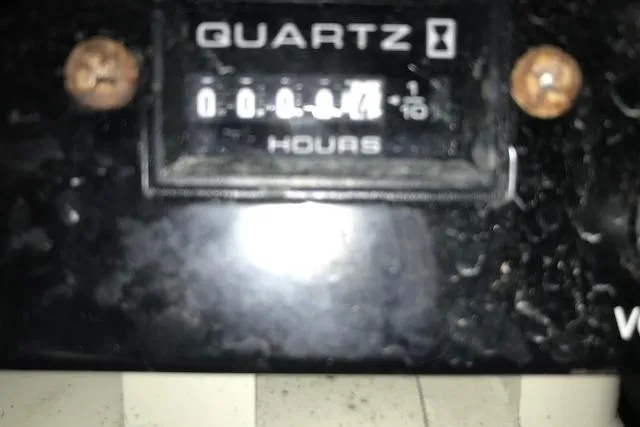 Slide: The Image of Close-up of a Quartz hour meter on a 2003 Grady-White Express 330 boat. - 14