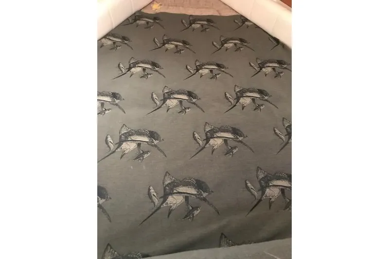 Slide: The Image of Patterned fabric with fish design on Grady-White Express 330, 2003 model. - 22