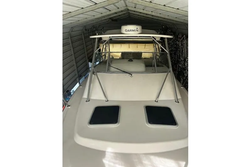 Slide: The Image of 2003 Grady-White Express 330 boat in storage with Garmin equipment. - 30