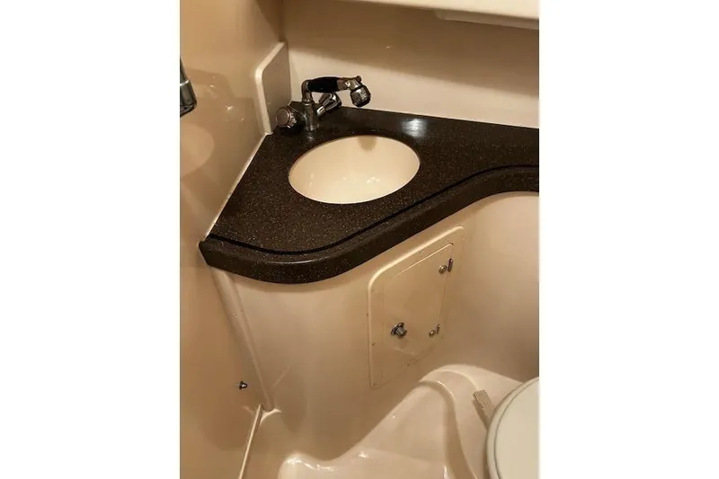 Slide: The Image of 2003 Grady-White Express 330 boat bathroom with sink and countertop. - 39