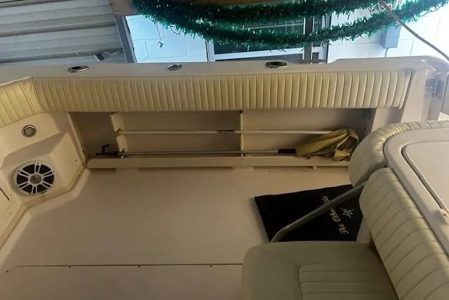 Slide: The Image of 2003 Grady-White Express 330 boat interior with seating and storage area. - 40