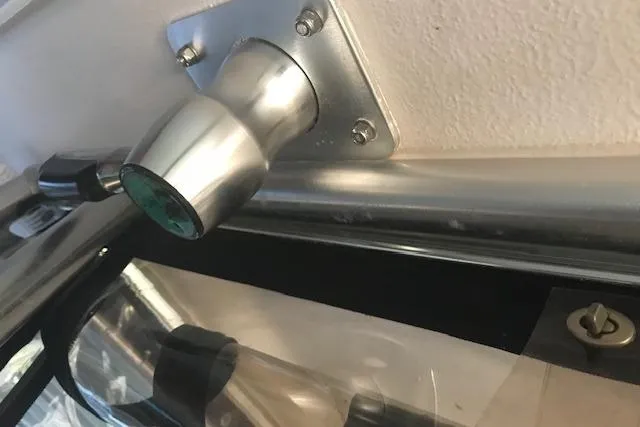 Slide: The Image of Close-up of a 2003 Grady-White Express 330 boat's metal fixture detail. - 41