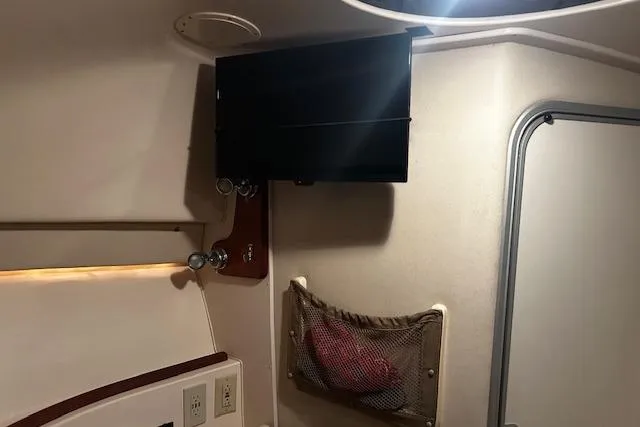 Slide: The Image of Interior cabin of 2003 Grady-White Express 330 boat with storage and TV. - 47