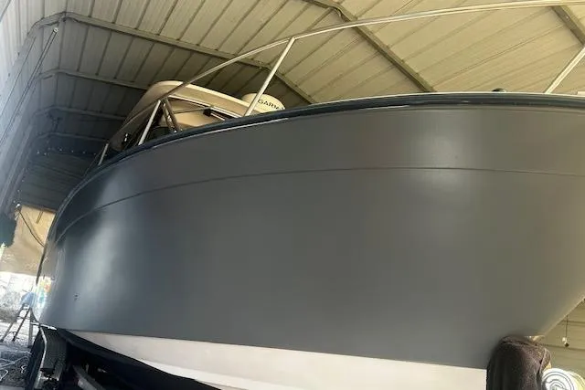 Slide: The Image of 2003 Grady-White Express 330 boat under a metal shelter, side view. - 6