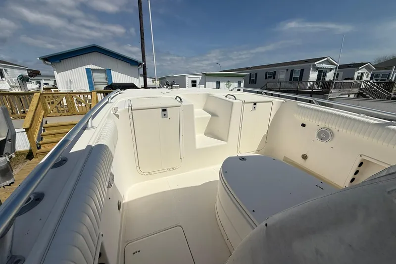 Slide: The Image of 2005 World Cat 330 TE boat interior with seating and storage compartments. - 13
