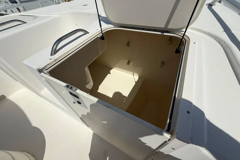 Slide: The Image of Open storage compartment on a 2005 World Cat 330 TE boat. - 15