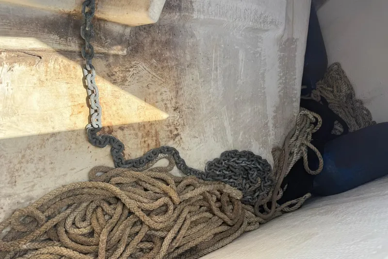 Slide: The Image of Ropes and chains in a 2005 World Cat 330 TE boat storage area. - 17