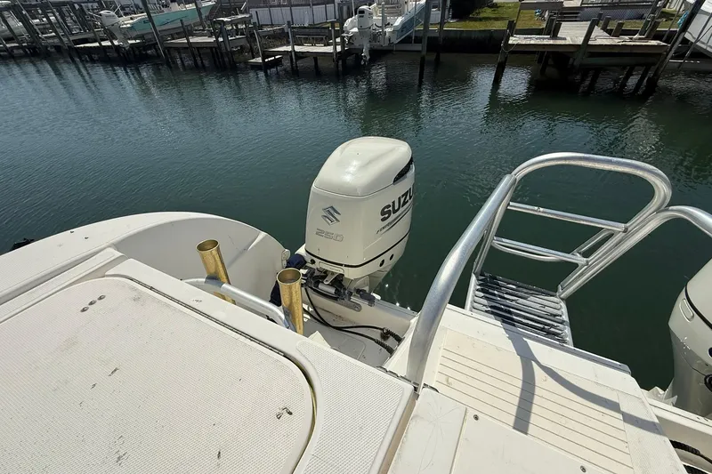 Slide: The Image of 2005 World Cat 330 TE boat with Suzuki 250 outboard motor at dock. - 27
