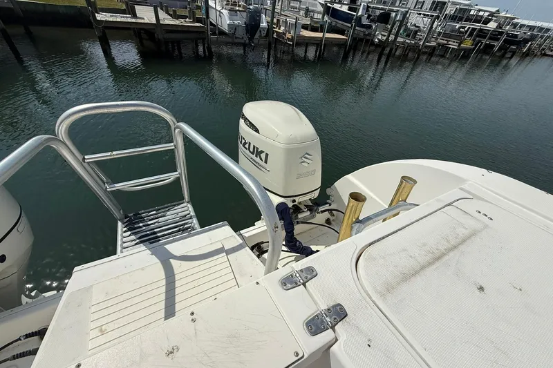 Slide: The Image of 2005 World Cat 330 TE boat with Suzuki outboard engine at dockside. - 28