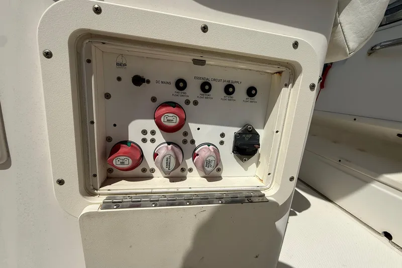 Slide: The Image of Control panel of a 2005 World Cat 330 TE boat with switches and dials. - 32