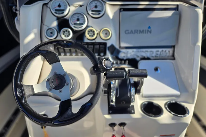Slide: The Image of Steering console of 2011 Glasstream 280 SCX with Garmin navigation system and gauges. - 11