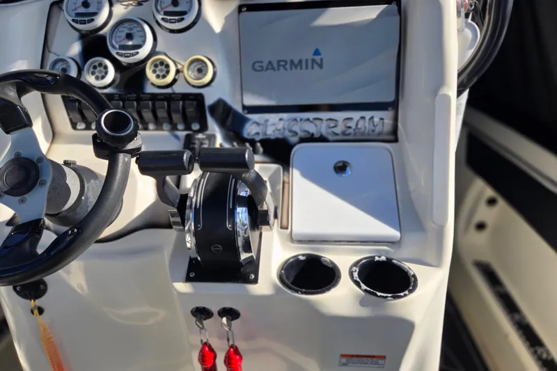 Slide: The Image of 2011 Glasstream 280 SCX boat dashboard with Garmin navigation system and controls. - 12