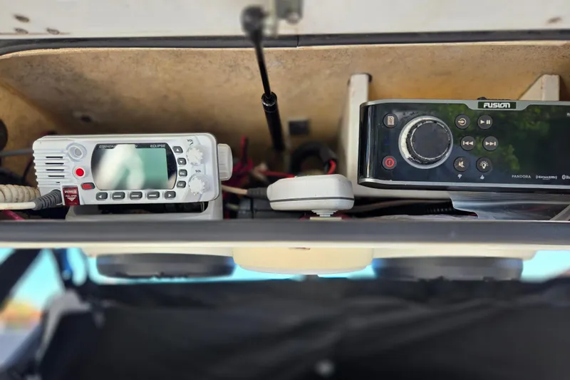 Slide: The Image of 2011 Glasstream 280 SCX boat electronics, featuring a radio and control panel. - 17