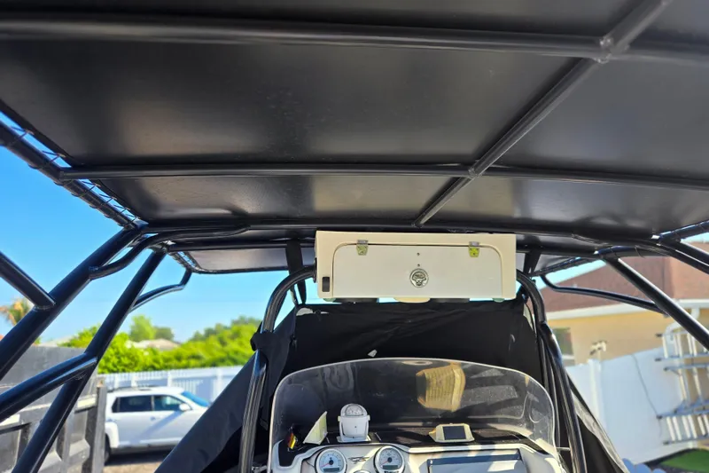 Slide: The Image of Interior view of a 2011 Glasstream 280 SCX boat with dashboard and canopy. - 23