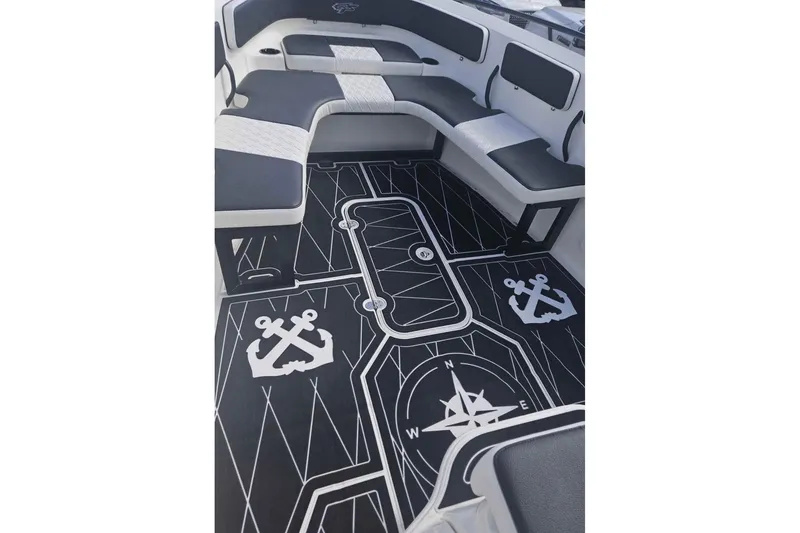 Slide: The Image of 2011 Glasstream 280 SCX boat interior with custom nautical-themed flooring and seating. - 3