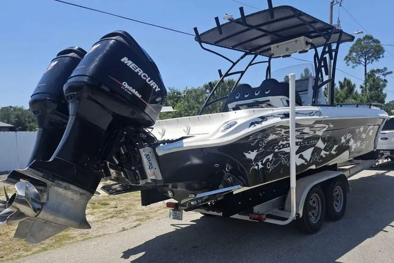 Slide: The Image of 2011 Glasstream 280 SCX boat with dual Mercury engines on a trailer. - 6