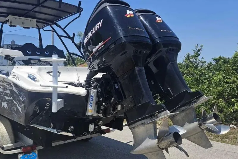Slide: The Image of 2011 Glasstream 280 SCX boat with dual Mercury outboard engines on a trailer. - 8