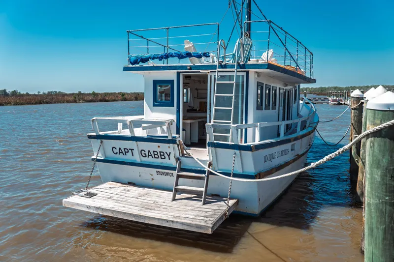 The Image of 1977 Saint Augustine 43 Trawler docked, named "Capt Gabby," offering unique charters. - 1
