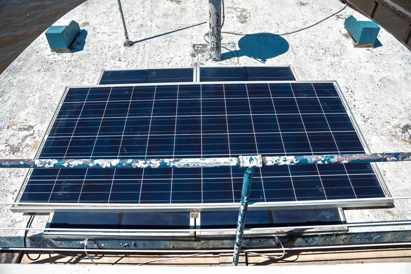 Slide: The Image of Solar panels on 1977 Saint Augustine 43 Trawler deck, generating renewable energy. - 17