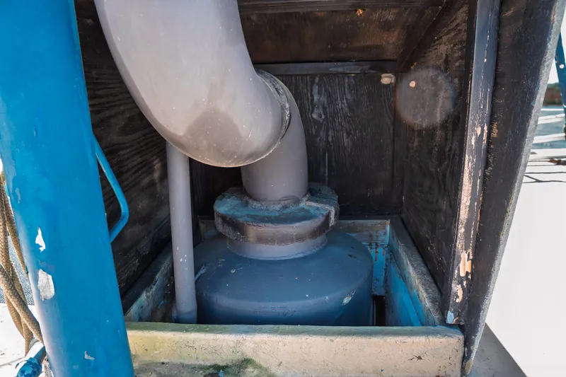 Slide: The Image of 1977 Saint Augustine Trawler 43 engine compartment with visible piping and components. - 20