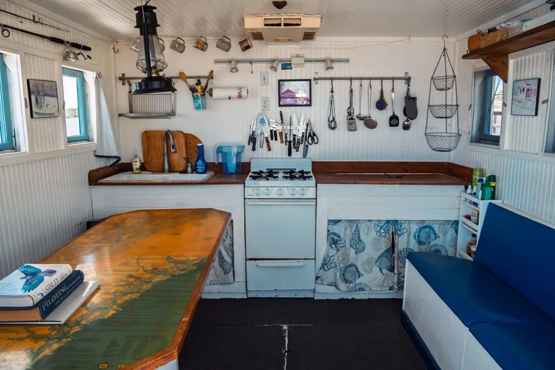Slide: The Image of Interior of a 1977 Saint Augustine 43 Trawler with kitchen and dining area. - 24