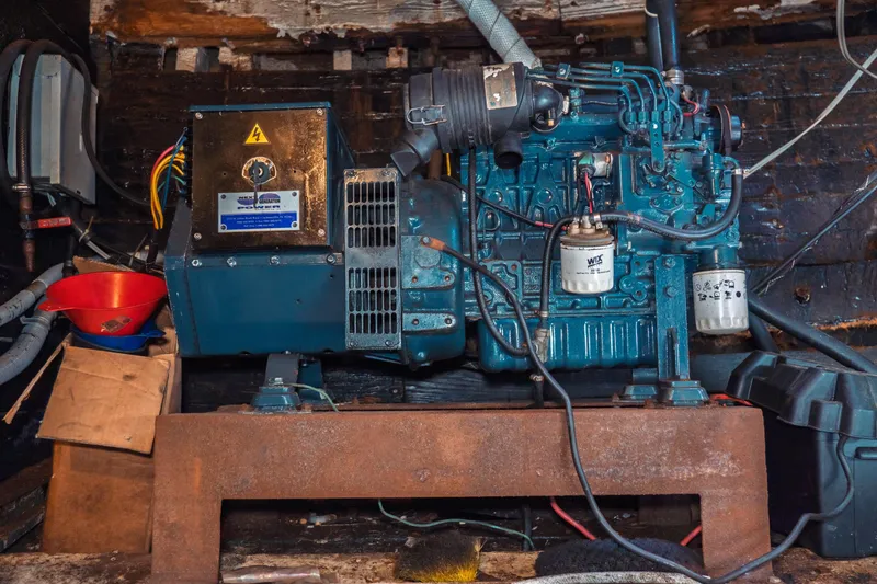 Slide: The Image of Engine room of a 1977 Saint Augustine 43 Trawler, showcasing machinery and components. - 63