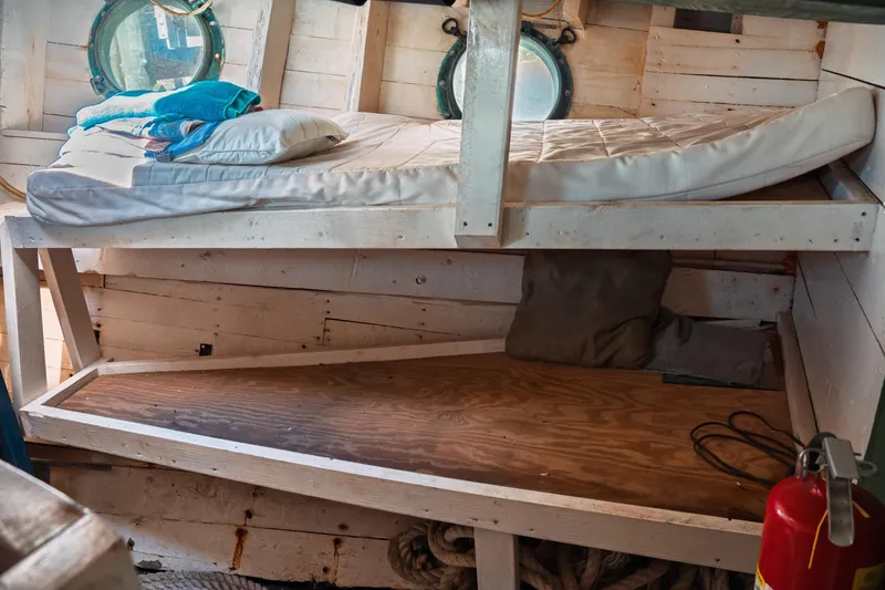 Slide: The Image of Cozy cabin interior of 1977 Saint Augustine 43 Trawler with bunk beds and portholes. - 68